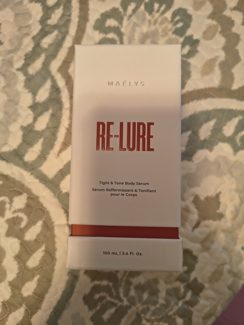 MAËLYS RE-LURE Tight & Tone Body Serum - White with Red Accents